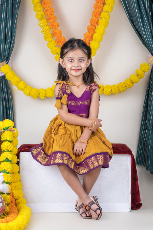Turmeric yellow with mulberry combination tie up dress for baby girl