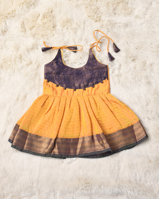 Anisha - Golden yellow with purple pattu silk ethnic wear for baby girl