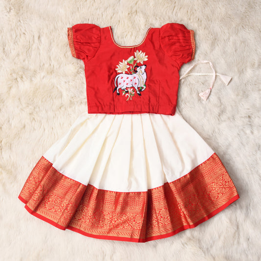 Aahana - red and white traditional langa blouse kamadenu cow embroidered zari border ethnic wear pattu pavadai silk for baby girl