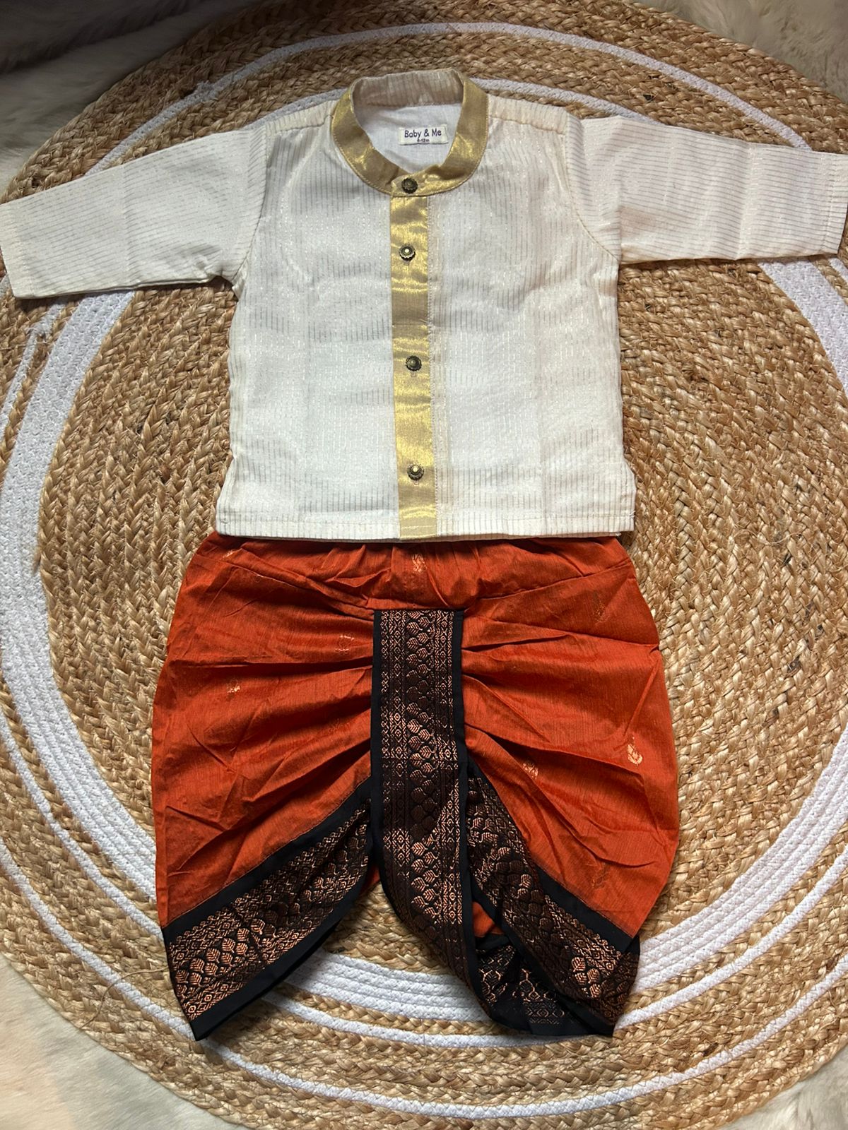 White with gold Kurta and orange with black Dhoti for baby boy